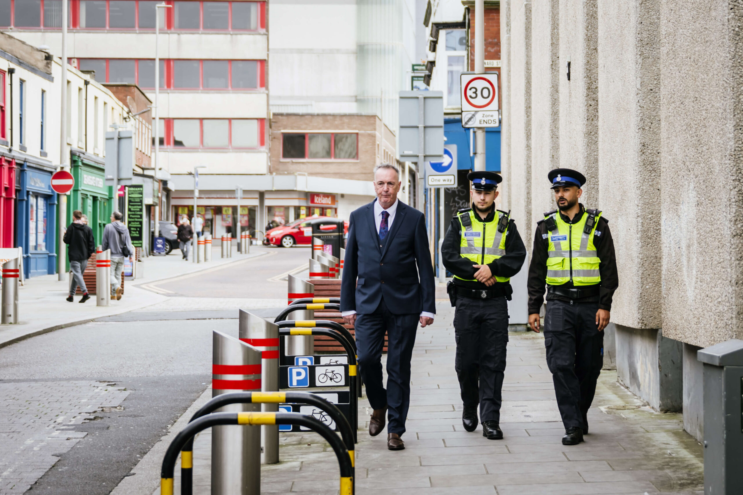 Commissioner Grunshaw and officers walking down the street