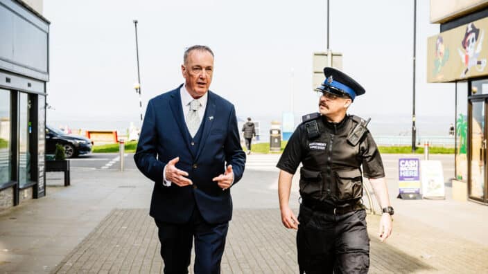 Commissioner Clive Grunshaw with officer